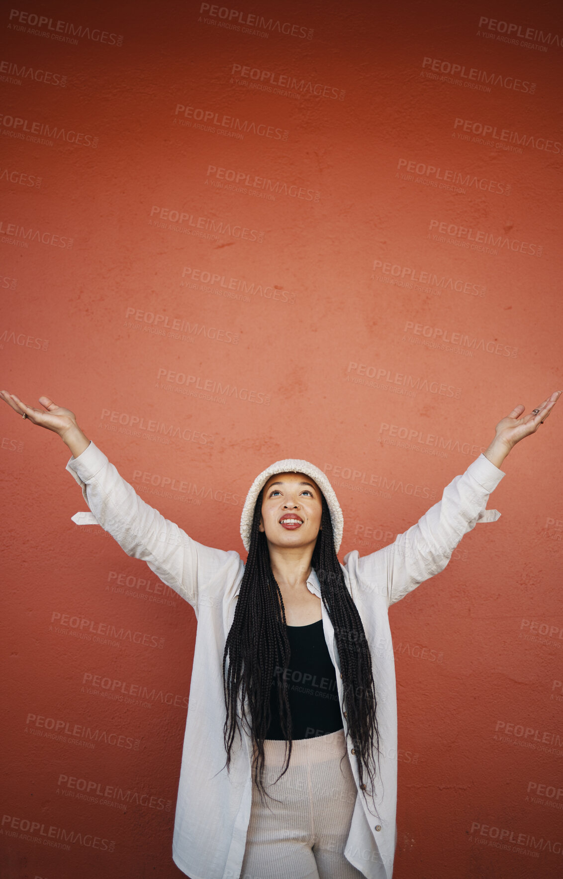 Buy stock photo Woman, fashion and arms up for wall and mockup space with urban style and trendy clothing. Freedom, hipster female person and modern confidence with red background and edgy gen z clothes of a girl