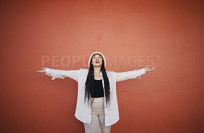 Buy stock photo Excited woman, fashion and arms up for wall and mockup space with urban style and trendy clothing. Freedom, hipster female person and confidence with red background and edgy gen z clothes of a girl