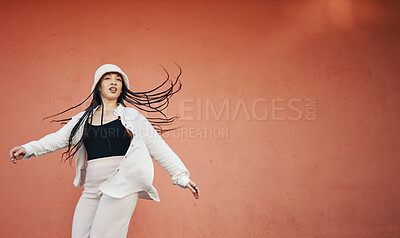 Buy stock photo Fashion, space and an urban woman on a red background for freedom, energy or unique street style. Wall, mock up and hip hop with a young gen z person on a color backdrop for marketing or advertising