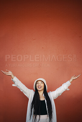 Buy stock photo Happy woman, fashion and arms up for wall and mockup space with urban style and trendy clothing. Freedom, female person and confidence with red background and edgy gen z clothes of a girl smile