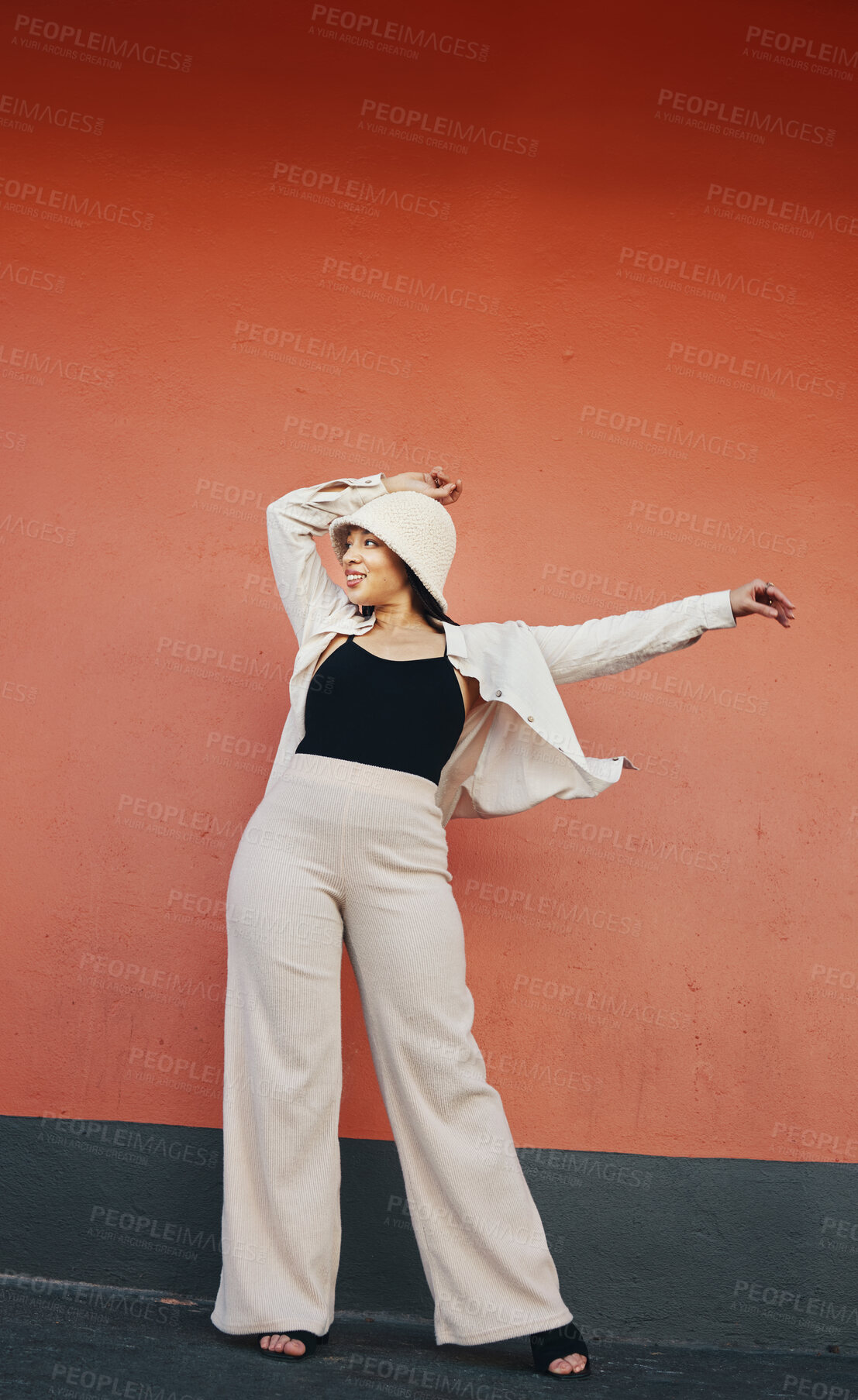 Buy stock photo Happy woman, fashion and city wall with freedom, hipster style and urban clothes with confidence. Red background and stylish female person in town with cool and streetwear outfit and thinking