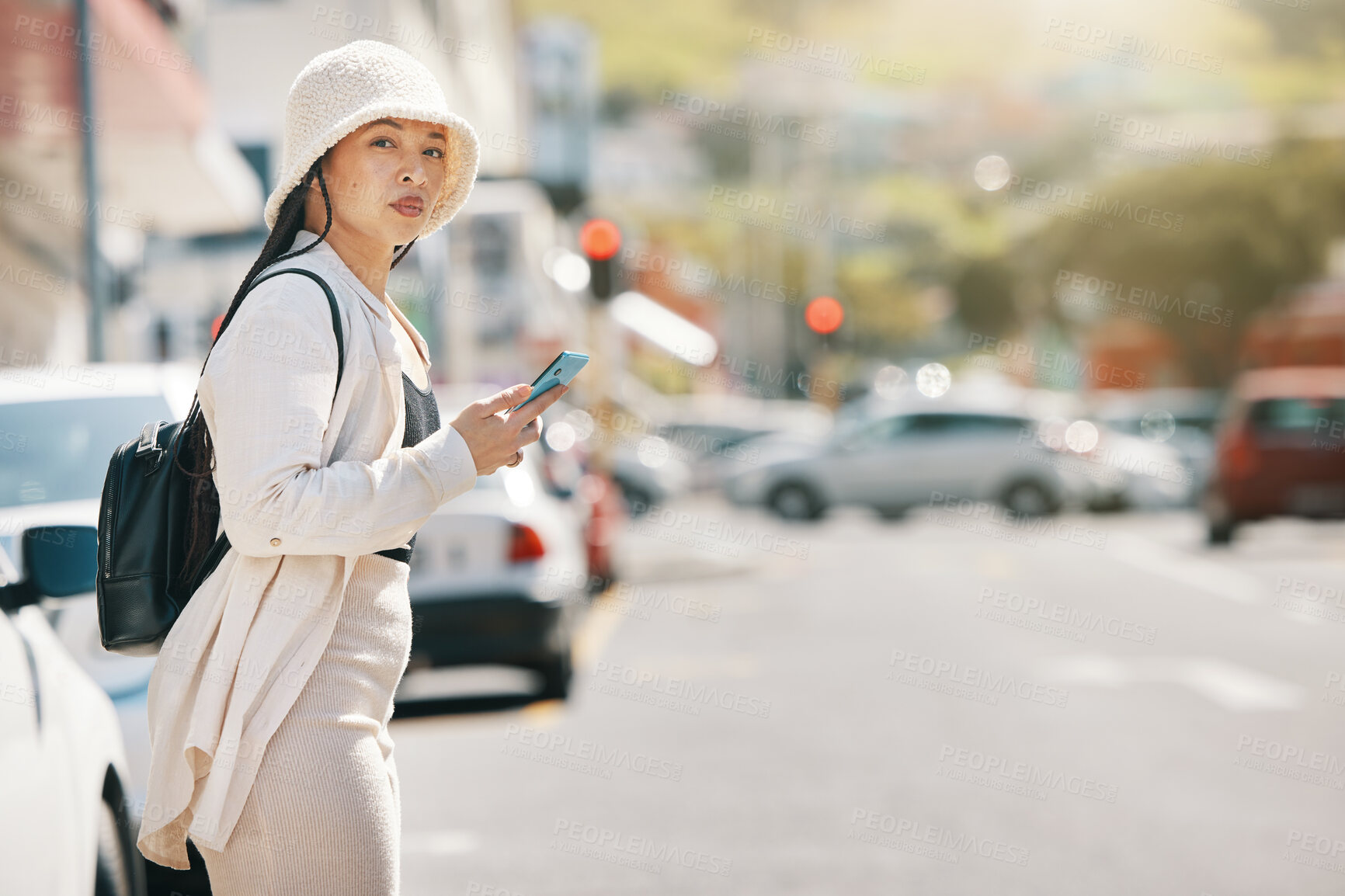 Buy stock photo Street, and woman waiting for taxi with phone and wall thinking about commute in city. Road, urban and female person with mobile in New York with travel, journey and holiday adventure on solo trip