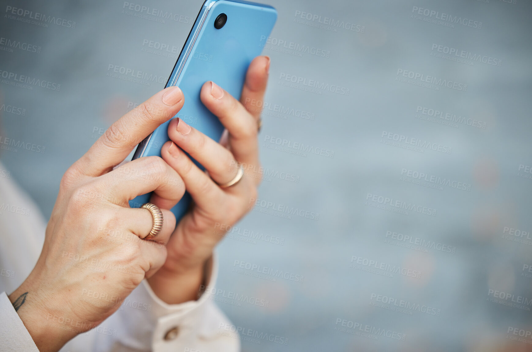 Buy stock photo Hands, phone and space with a person closeup on a blurred gray background for social media, communication or networking. Mobile, contact and app with an adult typing or reading a text message