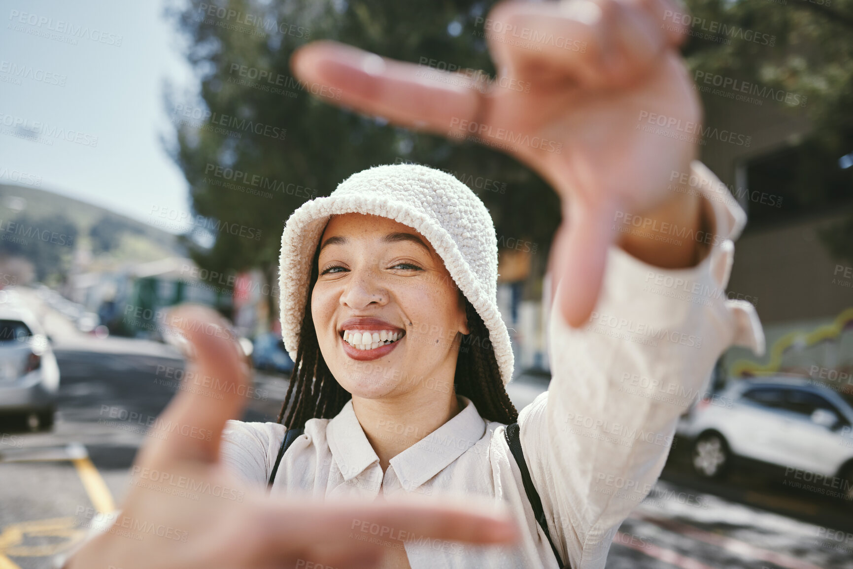 Buy stock photo Happy woman, portrait and frame in city for photography, fashion or outdoor memory in selfie. Female person smile with hands framing face for photograph, picture or social media tour in urban town