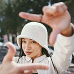 Portrait, hands frame and happy woman in city or urban town outdoor. Face, finger border and person smile for photographer selfie, profile picture and creative in perspective for stylish fashion hat