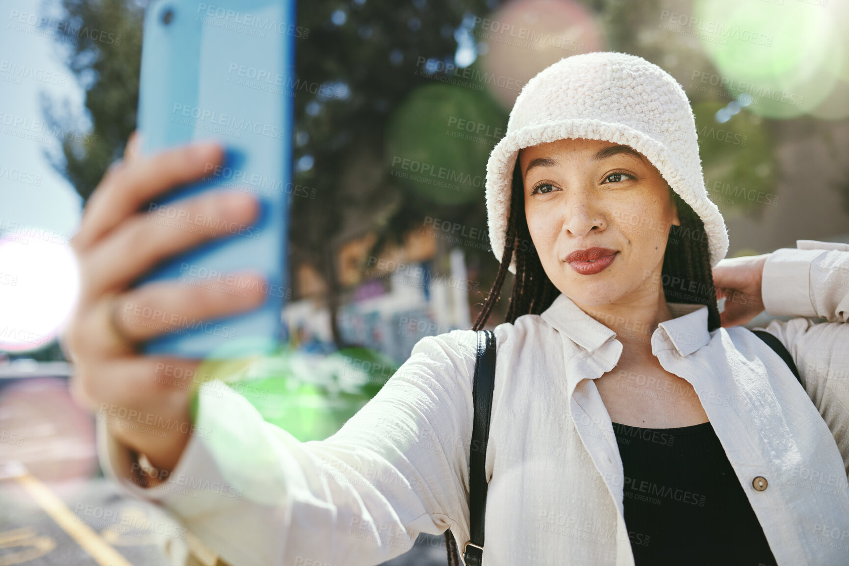 Buy stock photo Woman on city street with selfie, travel blog and holiday memory for social media in streetwear. Influencer, streamer or gen z girl with urban fashion, photography or content creation with lens flare