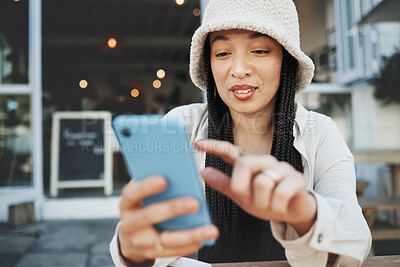 Buy stock photo Travel, student and woman with phone at a cafe for social media, texting or chatting in a city. Smartphone, app and lady influencer at coffee shop for content creation, podcast or traveling blog post