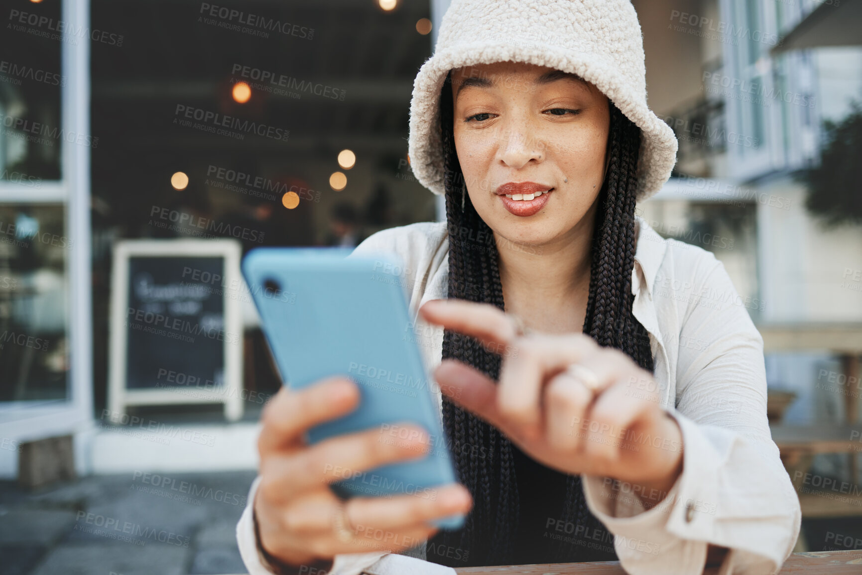 Buy stock photo Travel, student and woman with phone at a cafe for social media, texting or chatting in a city. Smartphone, app and lady influencer at coffee shop for content creation, podcast or traveling blog post