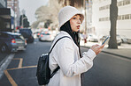 Woman on street with phone, taxi app and travel holiday with streetwear, waiting and online location. Influencer, blogger or gen z girl with urban fashion, smartphone and cab transport in city road