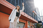 Road, walking and woman wave for taxi with travel, commute and ride in New York. Vacation, city street and urban with a female person with traveling and vacation on a trip for holiday adventure