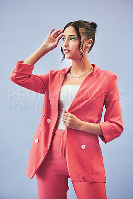 Buy stock photo Fashion, suit and woman in studio thinking, confidence and body in beauty aesthetic. Makeup, style and influencer girl in designer clothes, trendy promo or confident model standing on blue background