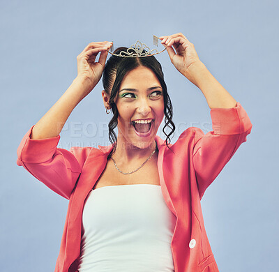 Buy stock photo Fashion, beauty and woman with crown in studio for glamour, luxury and winning prize. Excited, wow and isolated person with tiara for princess pride, confidence and cosmetics on purple background