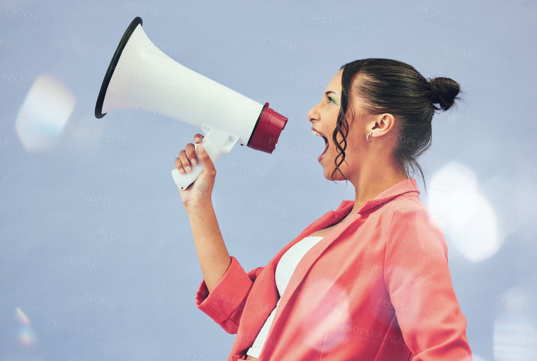 Buy stock photo Megaphone, protest or motivation with a woman shouting on a blue background in studio for politics. Noise, change and a young speaker screaming into a bullhorn for leadership, justice or freedom