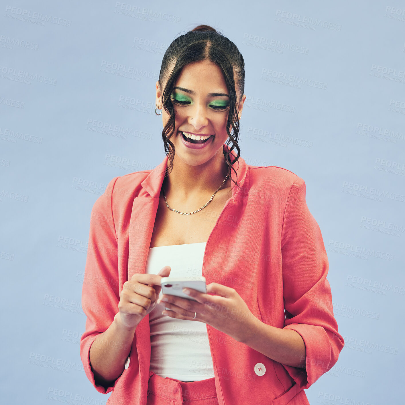 Buy stock photo Smile, typing and woman with a smartphone, connection and social media on a blue studio background. Person, model or girl with a cellphone, mobile user and search internet with beauty, makeup and app