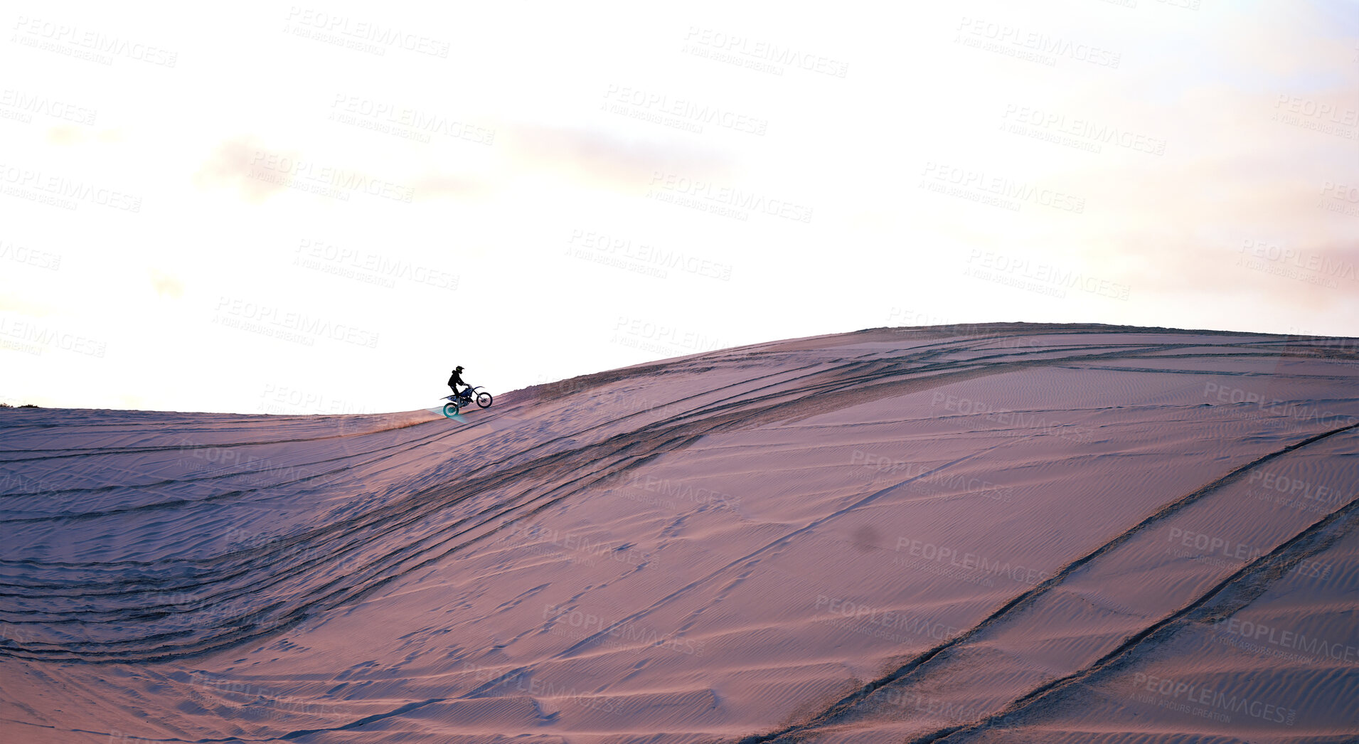 Buy stock photo Hill, desert mockup or athlete on motorcycle for action, adventure or fitness with wellness or space. Sunset, sand or sports driver on motorbike on dunes in training, exercise or race challenge 