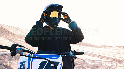 Buy stock photo Helmet, motorcycle and an off road biker outdoor for a race, competition or adrenaline in summer. Freedom, energy and flare with a sports rider on a course for power or speed in a reflective visor