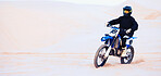 Sand, sports or athlete with motorcycle for action, adventure or fitness with performance for adrenaline. Sunset, desert or person on motorbike on dunes for training, exercise or race or challenge