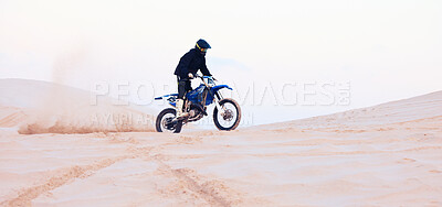 Buy stock photo Sand, dust or athlete driving motorcycle for action, adventure or fitness with performance or adrenaline. Desert, sports or person on motorbike on dunes for training, exercise or race or challenge