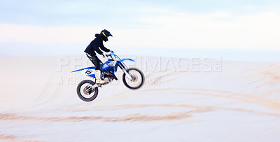 Buy stock photo Sand, jump or athlete driving motorcycle for fitness, adventure or action with performance or adrenaline. Desert, risk or sports person on motorbike on dunes for training, exercise or race challenge