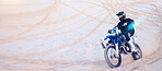 Fitness, desert and athlete on motorbike for action, adrenaline and skill training for challenge, Sports, sand dunes and man biker practicing for race, competition or performance adventure at a rally