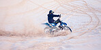 Dirt, sand or athlete driving motorbike for action, adventure or fitness with performance or adrenaline. Nature, dust or sports driver on motorcycle on dunes in training, exercise or race challenge