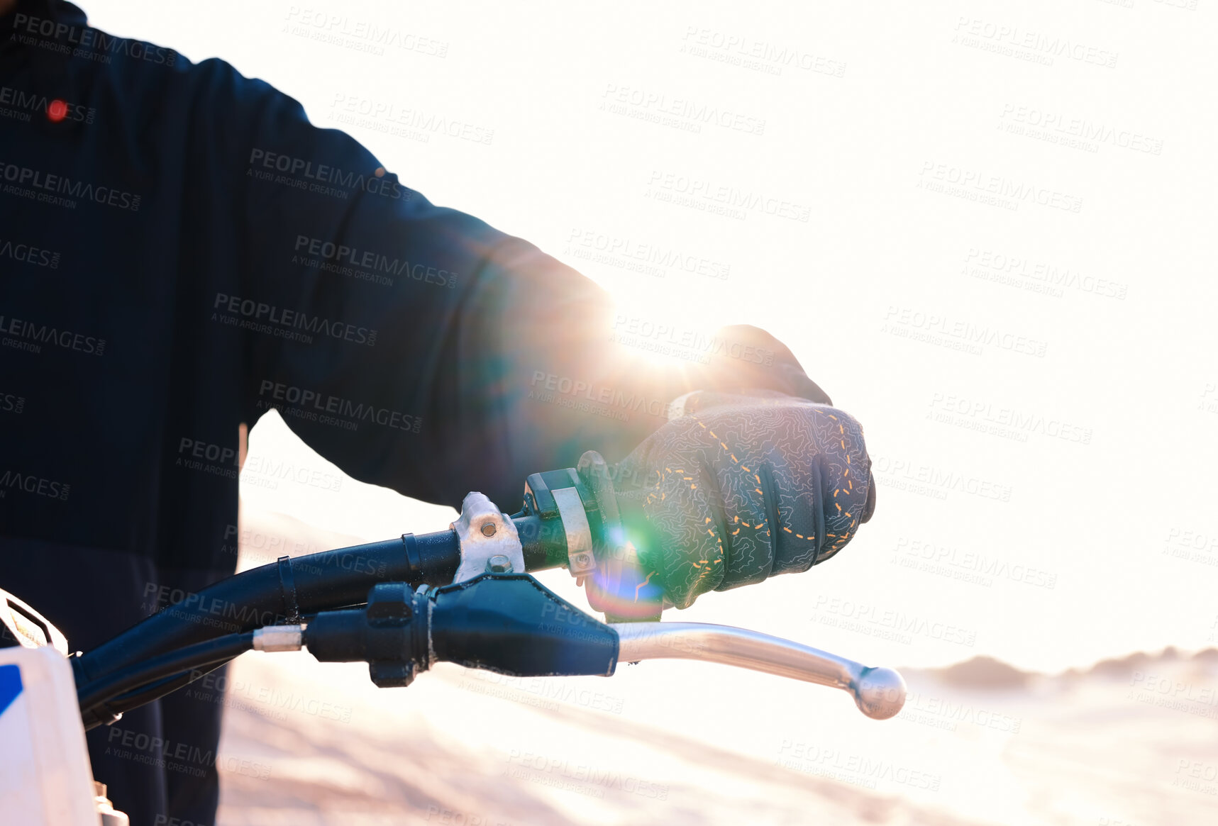 Buy stock photo Hand, bike and flare with a sports person closeup outdoor for an off ride race or competition on sand. Motorcycle, handle and control with a rider in the desert for speed, power or adrenaline