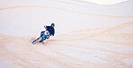 Motorcycle, desert and man training for sports, adventure or travel journey outdoor. Motorbike, rider and driver on sand, dirt and off road for freedom, extreme race and competition on mockup space