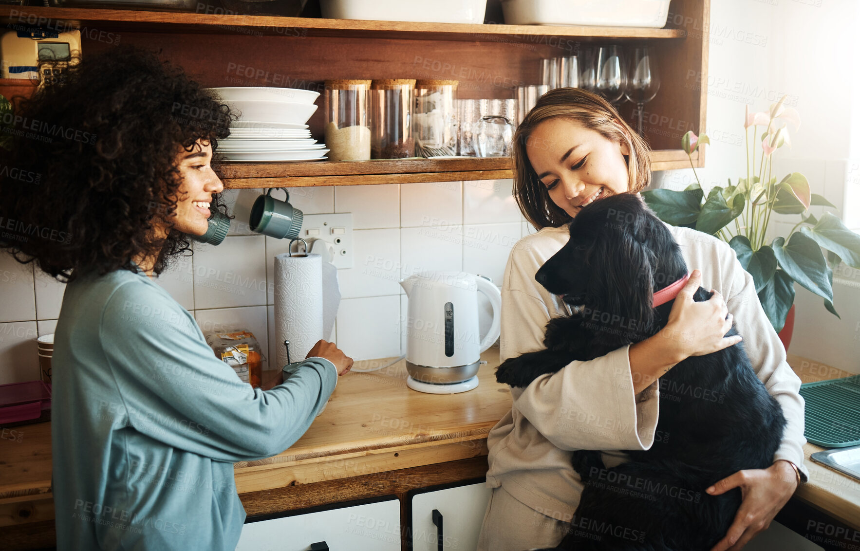 Buy stock photo Love, dog and morning with lesbian couple in kitchen for relax, support and care. Canine animal, happy and smile with gay women and pet puppy at home for bonding, playful and happiness together