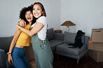 Lesbian, couple and hug for moving, home and dog in living room with excited, happiness and investment in apartment or property. Happy, people and women together with pet in celebration of new house