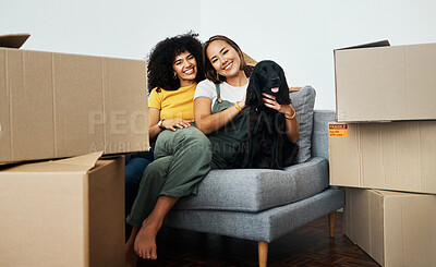 Buy stock photo Real estate, portrait and lesbian couple with a dog on the sofa for moving boxes and a new home. Smile, lgbt and women or people on the living room couch of an apartment with a pet after relocation