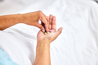 Pills in hands, healthcare and patient in hospital, medicine and wellness with sick person in bed. Health, medical care and pharmaceutical drugs for recovery, help and prescription while at clinic