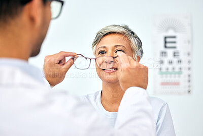 Buy stock photo Consulting, optometry and medical with old woman and doctor for eye care, glasses and lens. Healthcare, ophthalmology and vision with senior patient in clinic for exam, eyesight and prescription