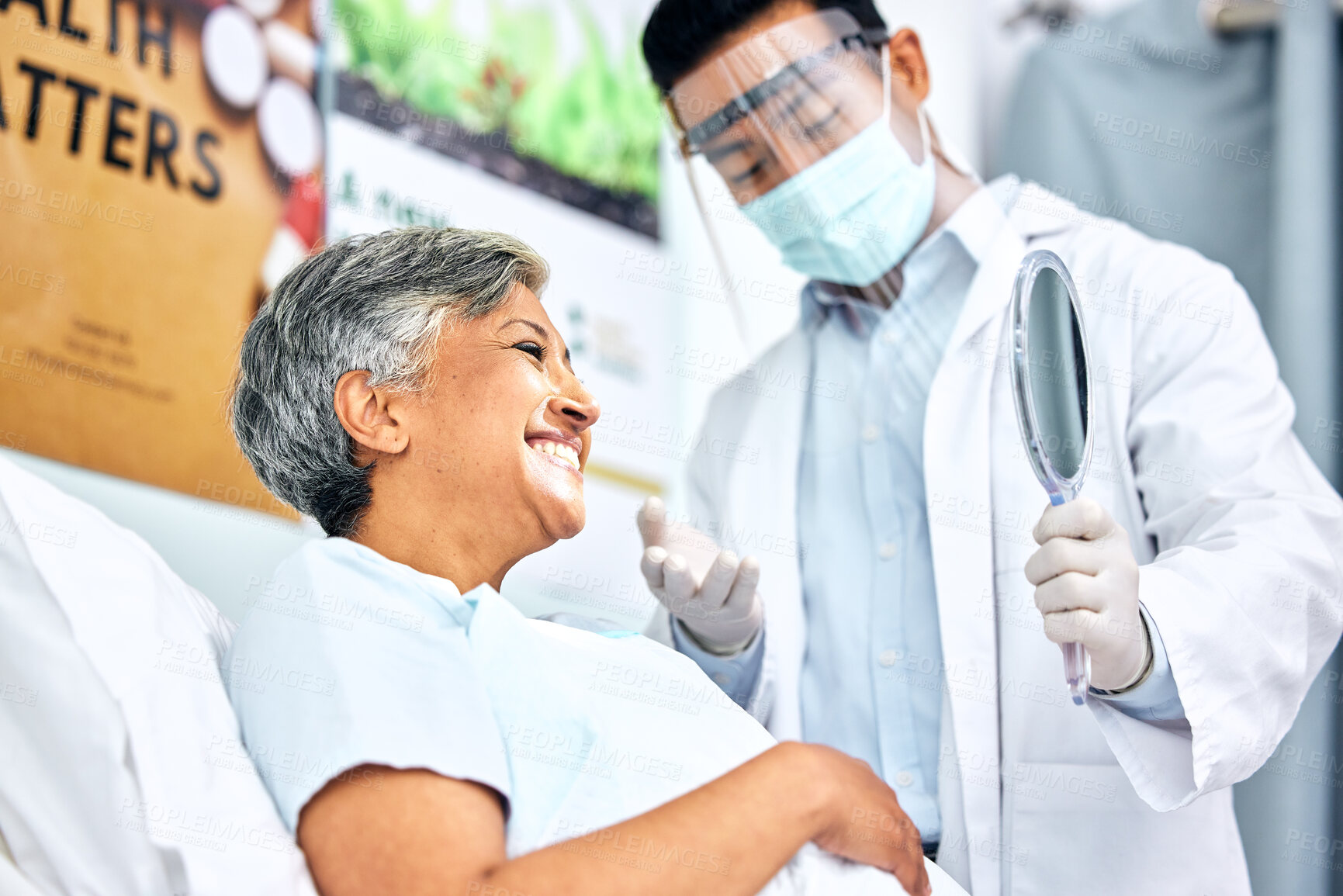 Buy stock photo Dentist in mask, patient with smile and mirror for healthcare, cleaning and hygiene for teeth. Happy woman in chair, dental care technician and safety in surgery on mouth, professional doctors office