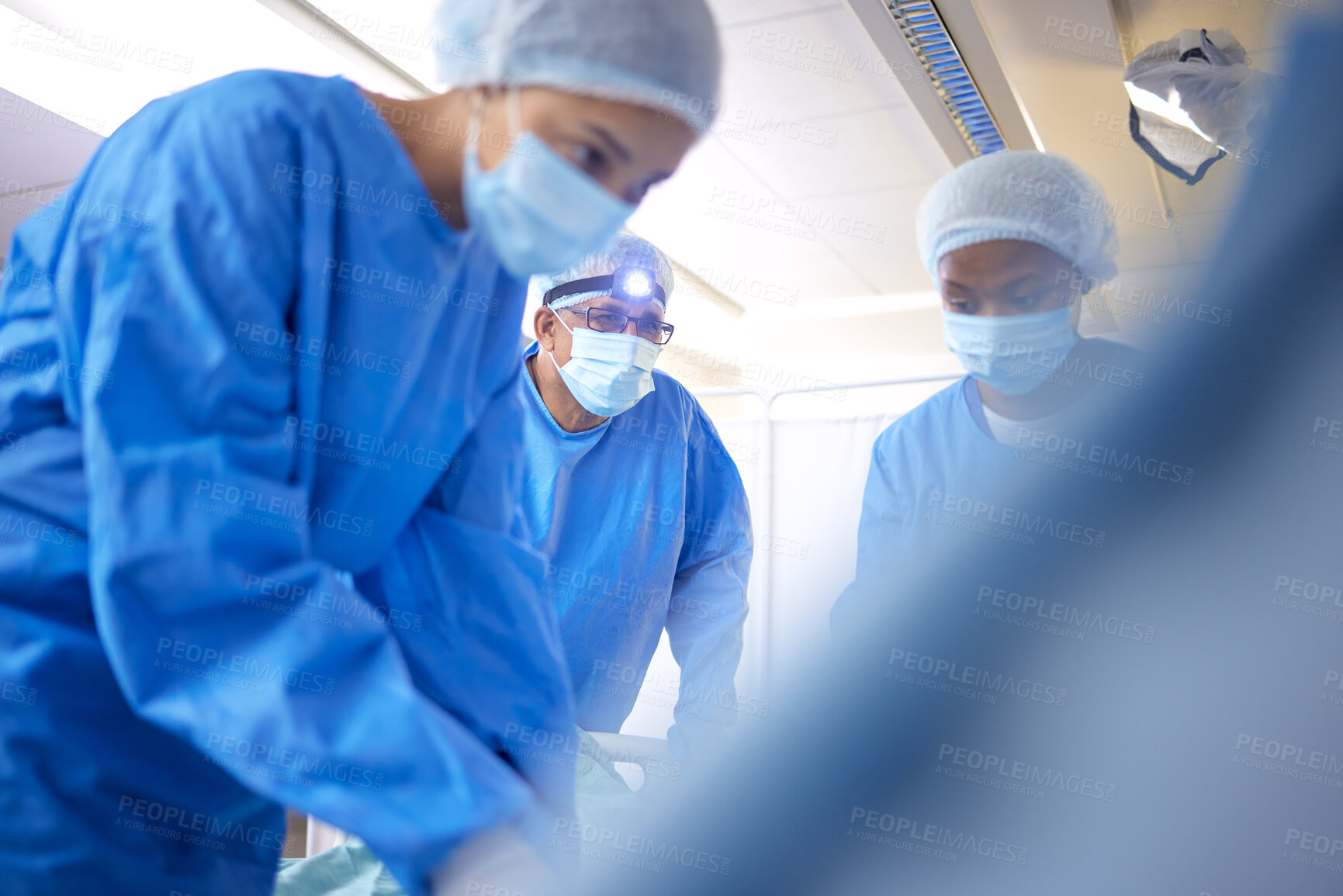 Buy stock photo Hospital, surgeon team and doctors for emergency, healthcare or medical procedure. Medicine, group and staff to start collaboration, surgery and operation with support and scrubs in ICU or theatre