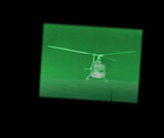Night vision, helicopter and military inspection for government surveillance for army. Plane, battlefield and air transportation with mission and airplane with green lighting with soldier search