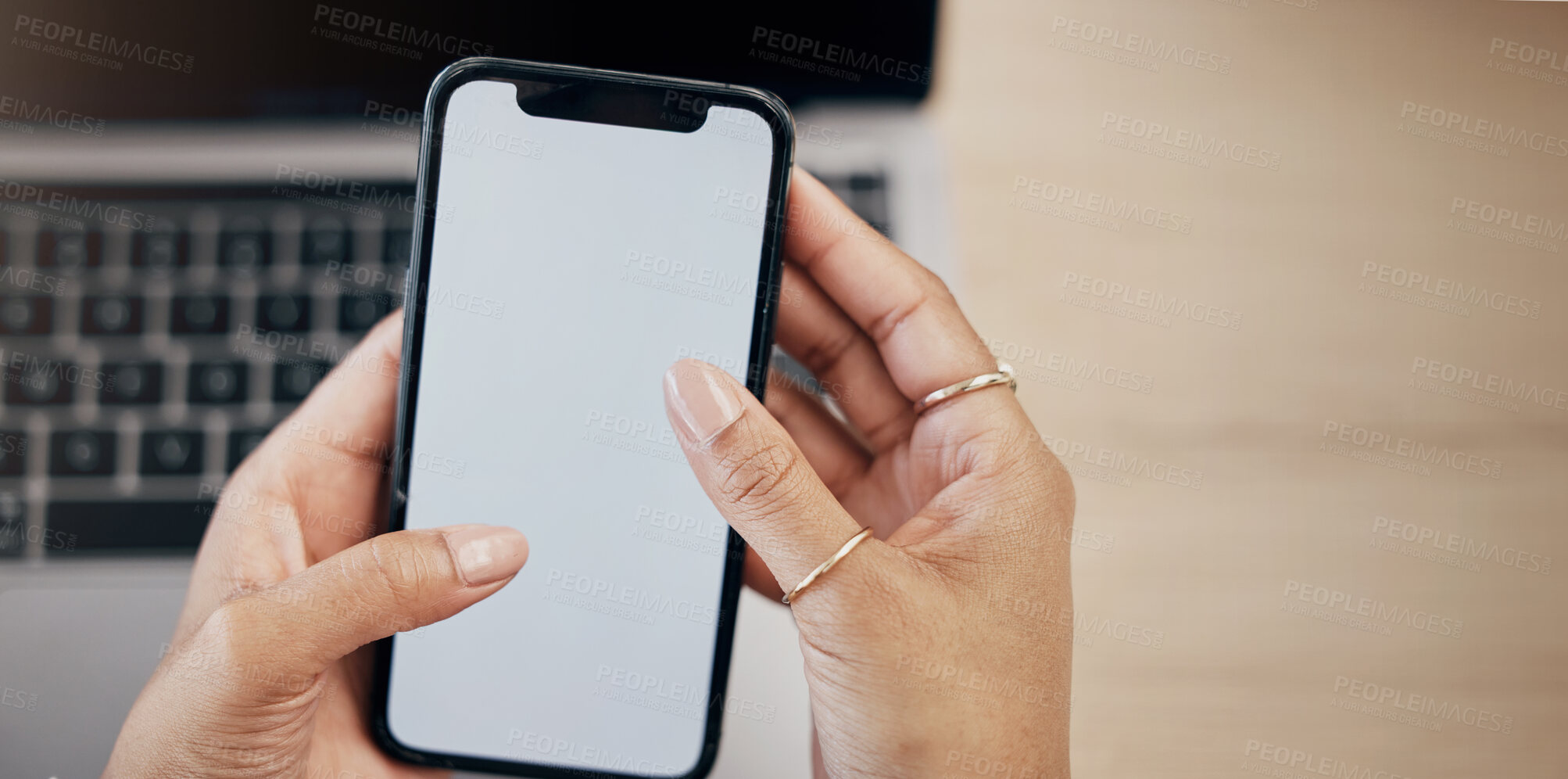 Buy stock photo Hands, blank phone screen and business woman with click, mobile app and mock up space in office. Entrepreneur, employee and smartphone with typing, scroll and check email notification in workplace
