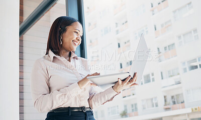 Buy stock photo Happy woman at office window, holding laptop and reading email, schedule or online for feedback. Internet, networking or communication on website, businesswoman at human resources agency at low angle