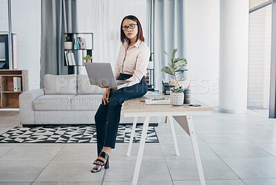 Buy stock photo Portrait, woman and office with laptop, working and thinking in corporate clothes, alone and serious. Sitting on desk, virtual meeting and writing report for client review and business manager stats