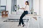 Woman in modern office with glasses, laptop and reading email, HR schedule and online report feedback. Website, networking or communication on digital app, businesswoman at human resources agency