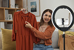 Influencer woman, show clothes and live stream with ring light, review and talking on social media app. Girl, fashion and web chat with presentation, feedback and broadcast with suggestion in home