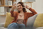 Selfie, peace hand sign and woman on couch, social media post with influencer at home and memory. Smile in picture for content creation, mobile app and relax in living room, V emoji and photography