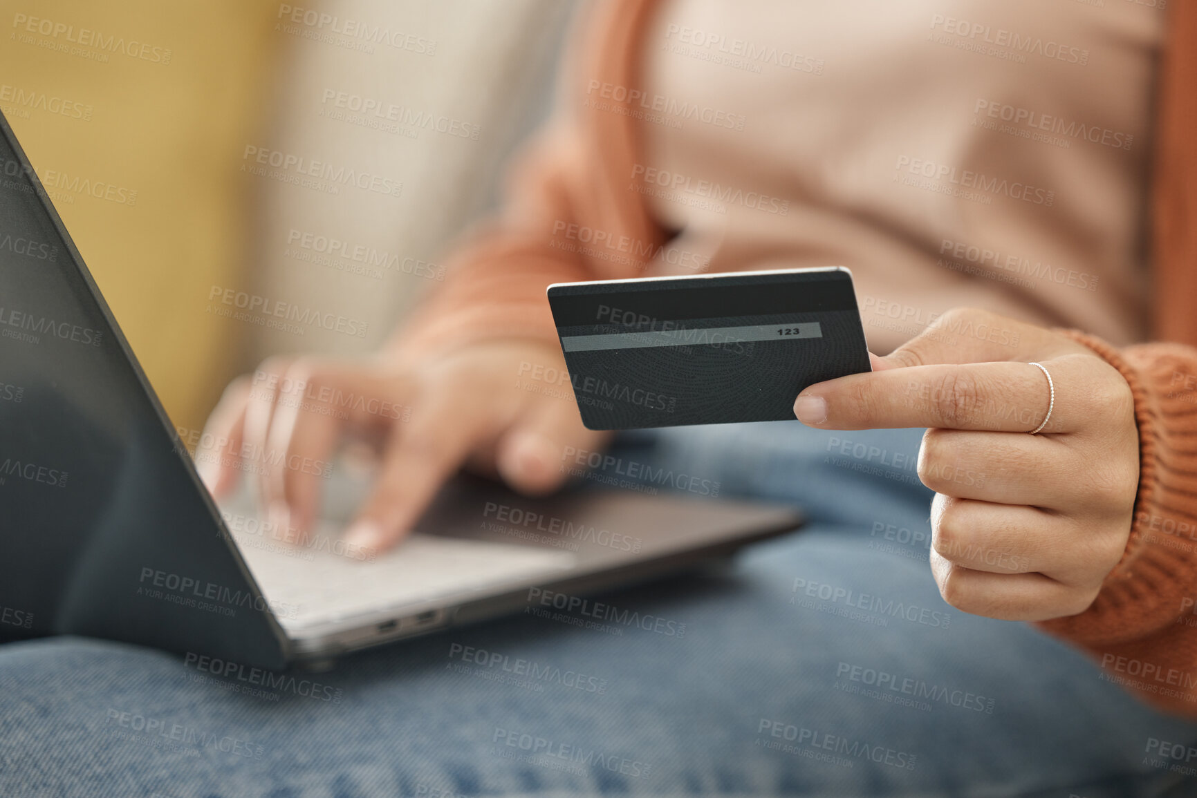 Buy stock photo Closeup, woman and laptop with credit card, online shopping and transaction in a lounge. Person, home and girl on a sofa, pc or digital app with payment, banking and budget with fintech or investment