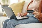 Closeup, woman and laptop with credit card, ecommerce and fintech with transaction, payment and digital app in a lounge. Person, home or girl on a sofa, pc or finance with online shopping and savings