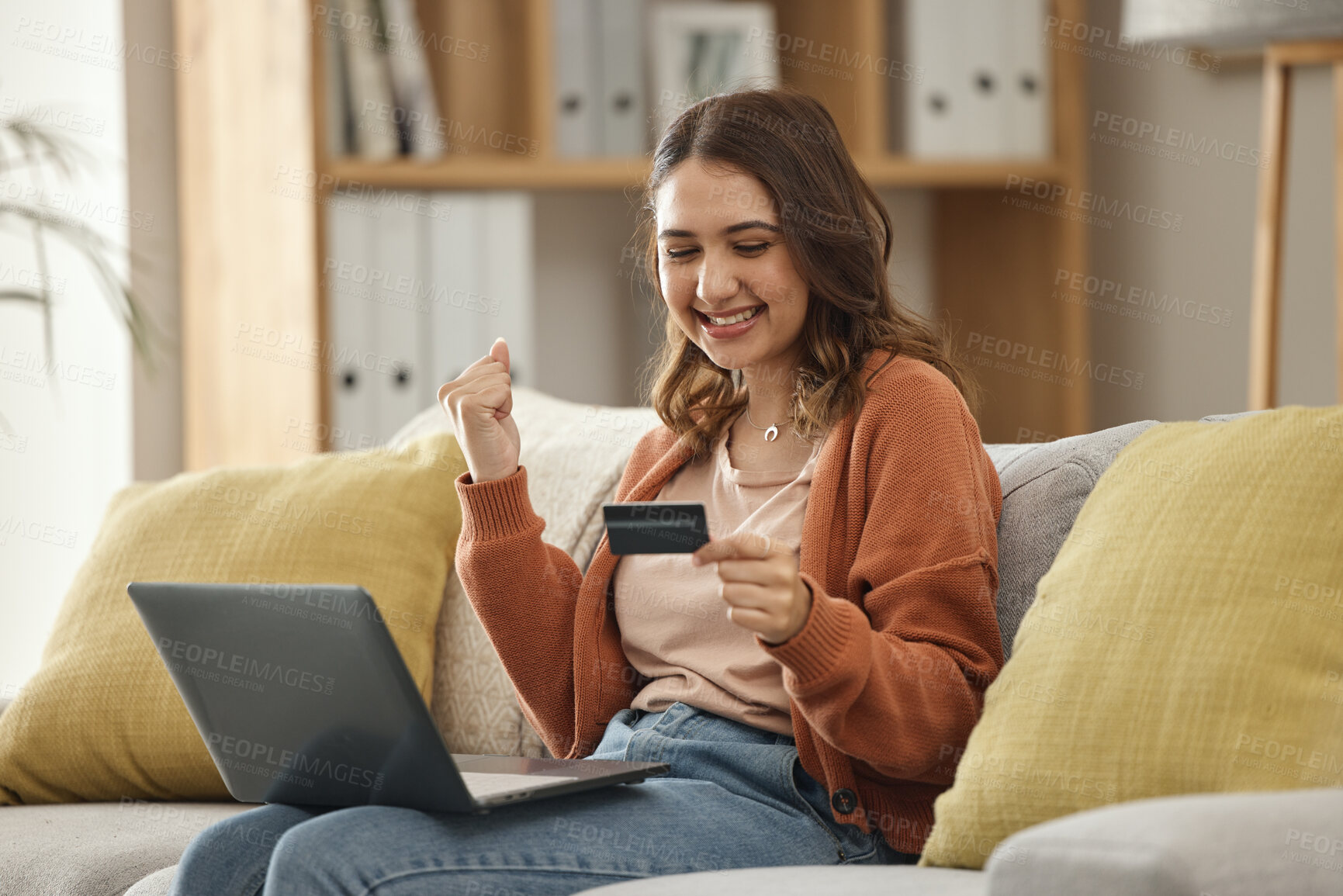 Buy stock photo Excited, woman and laptop with credit card, banking and online shopping with fintech, transaction and happiness in a lounge. Person, home and girl on a couch, pc and celebration with payment or bonus