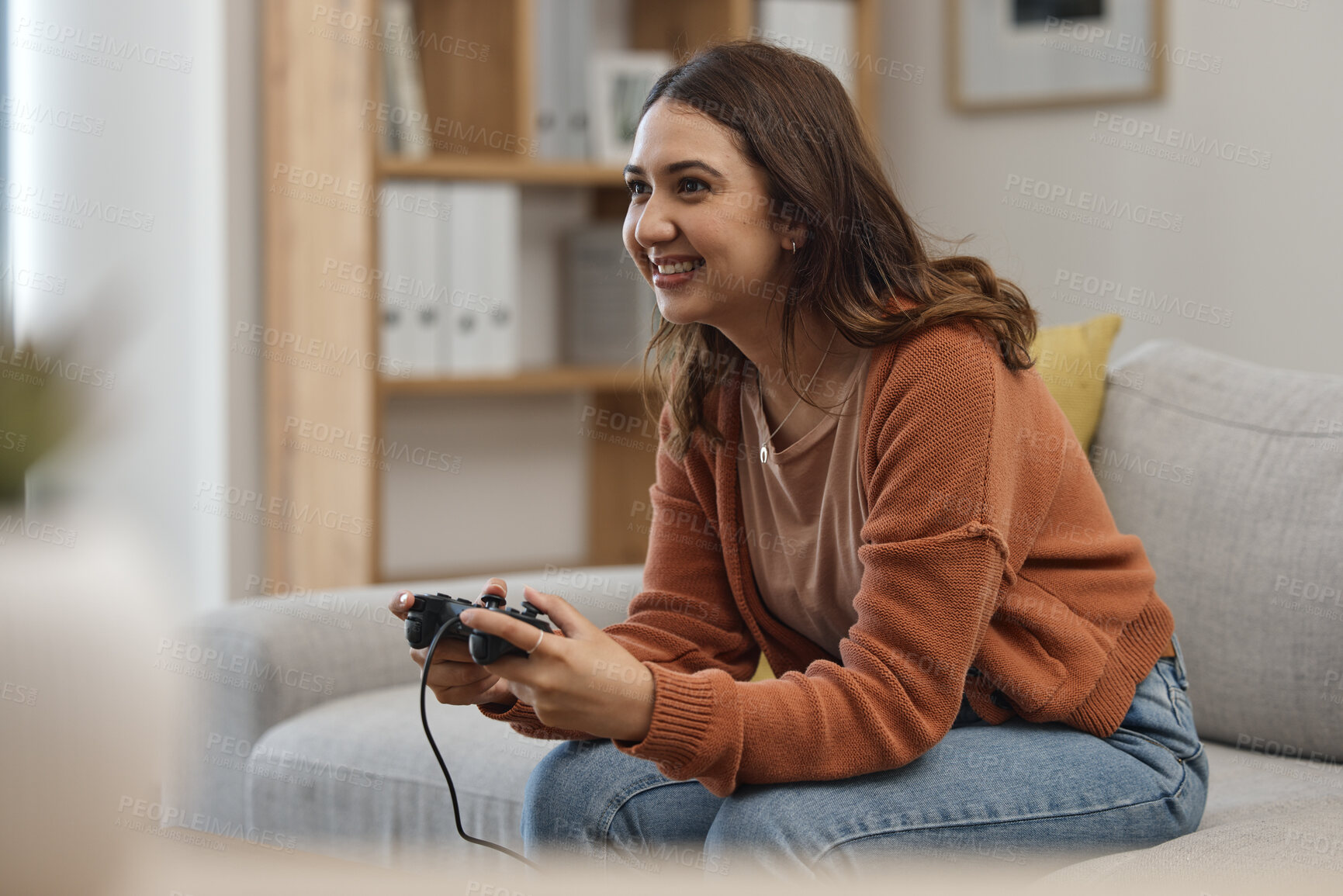 Buy stock photo Happy woman, sofa and playing video games in relax or free time in living room for entertainment at home. Female person smile with controller for console or online gaming on lounge couch in house