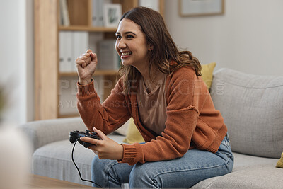 Buy stock photo Success, happy and a woman gaming on the sofa with a win, celebration and excited about competition. Smile, house and a girl with a console for a game, entertainment and achievement with technology