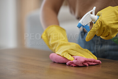 Buy stock photo Person, hands and spray bottle in cleaning or housekeeping on table for hygiene or disinfection at home. Closeup of domestic, maid or cleaner wiping furniture or desk for bacteria or germ removal