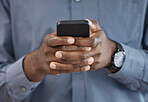 Phone, hands and closeup of businessman typing a message on the internet or mobile app. Technology, networking and African male person scroll on social media or website with cellphone in the office.