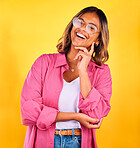 Happy, laugh and face of woman on yellow background with smile, laughter and cheerful. Fashion, style and isolated person with funny joke in trendy clothes, stylish outfit and glasses in studio