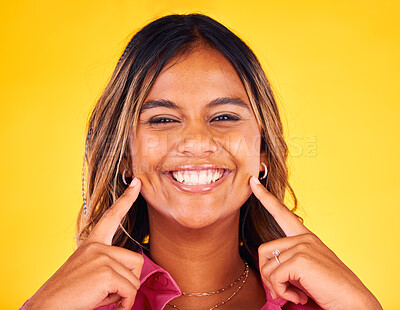 Buy stock photo Pointing, smile and portrait of woman on yellow background with confidence, happy and hand gesture. Dental care, mouth and face of person for teeth whitening, cleaning and oral health in studio